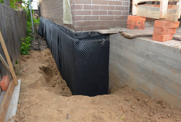 Happy homeowners after waterproofing job in Dover